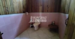 Venta de Terreno con Casa y Naciente de Agua en Omoa Cortes Honduras