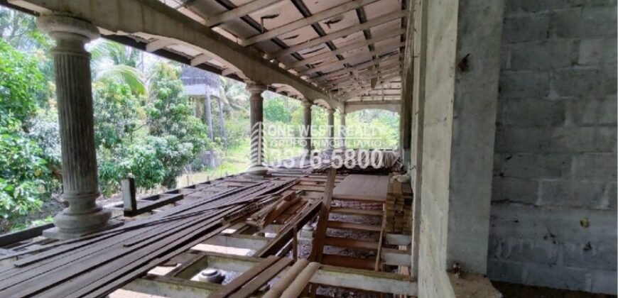 Terreno de venta en Omoa Cortes con naciente de agua y cabañas
