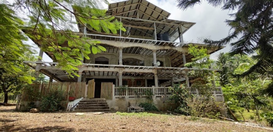 Terreno de venta en Omoa Cortes con naciente de agua y cabañas